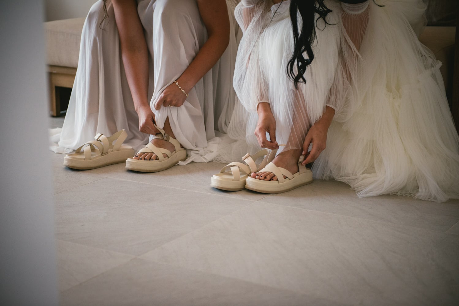 Brides putting on their shoes, final touches for their Corfu elopement.