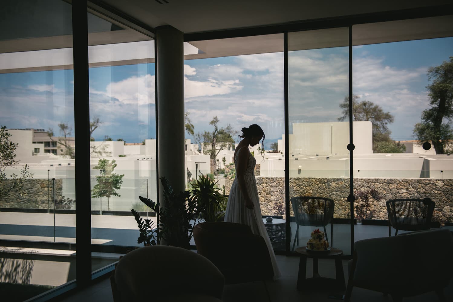 Bride captured in the hotel, beauty and excitement before her Corfu elopement.