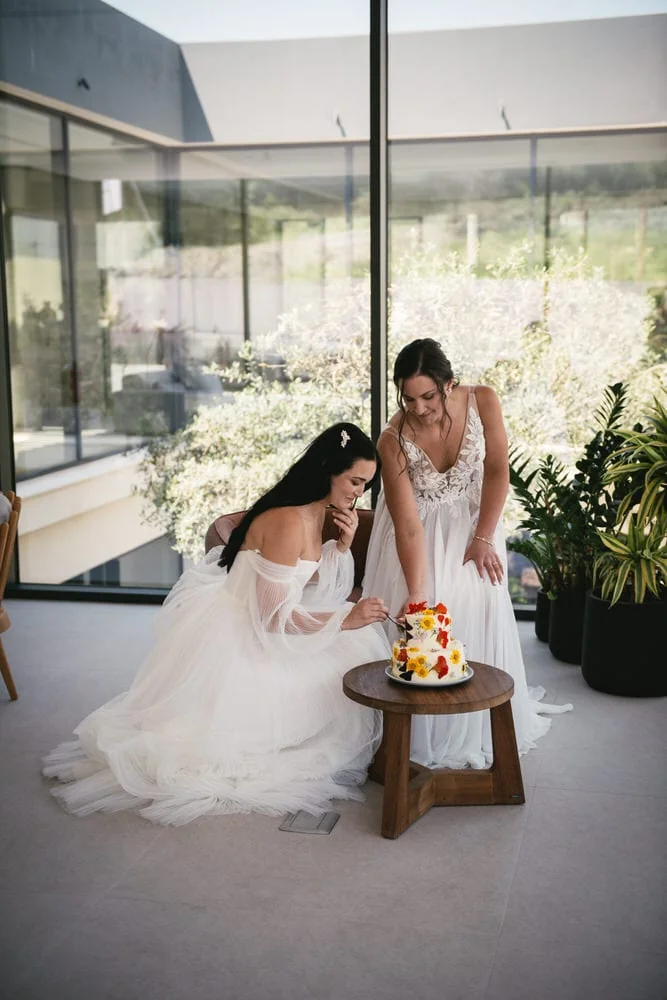 Brides cutting their cake, shared moments during their Corfu elopement.