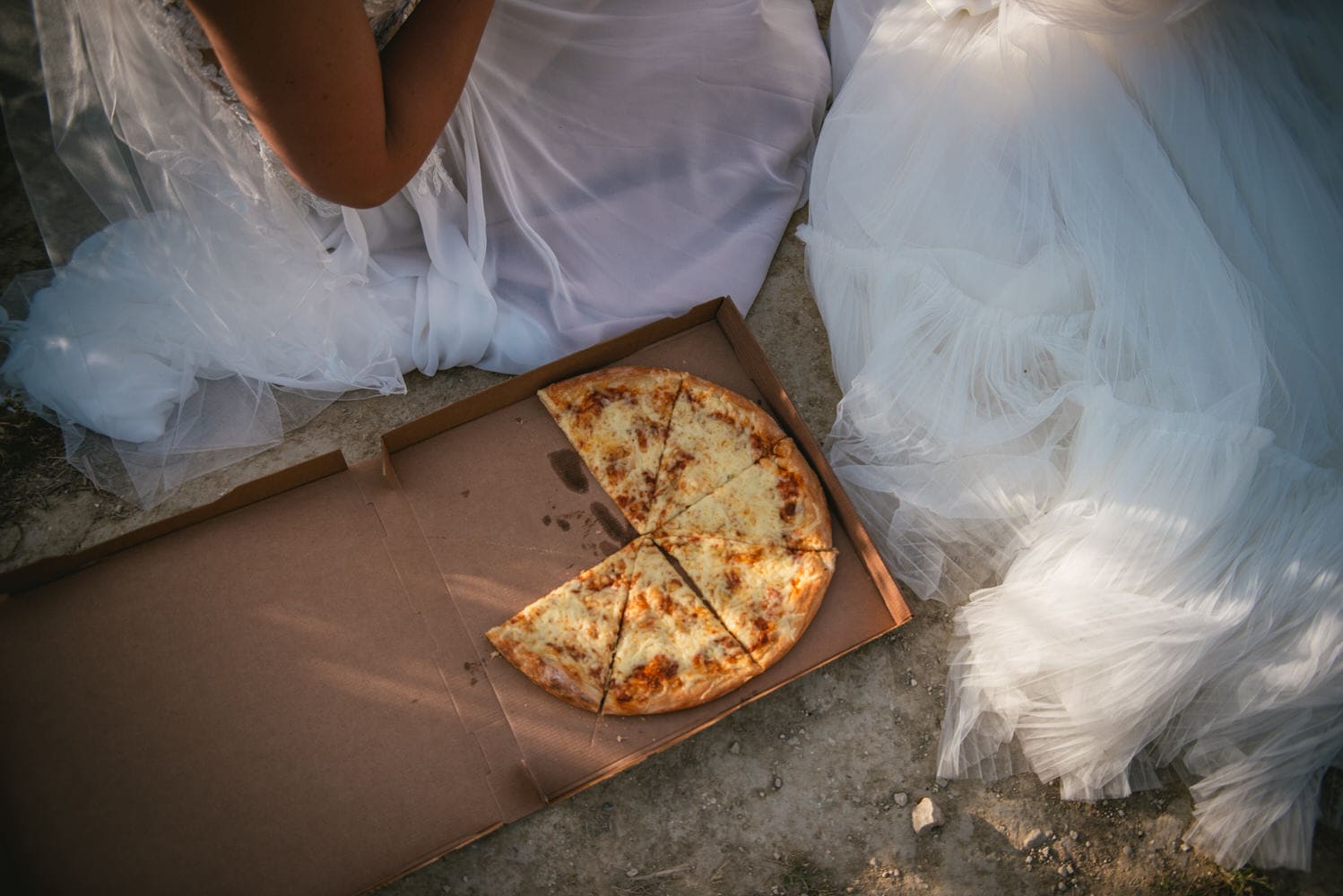 Culinary celebration: Brides savor local flavors on the shores of Corfu during their elopement.