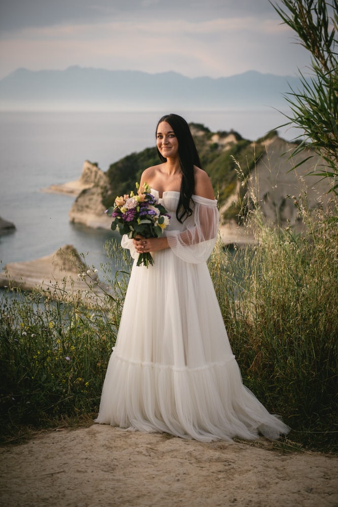 Bride captured at sunset, golden moments of her Corfu elopement.