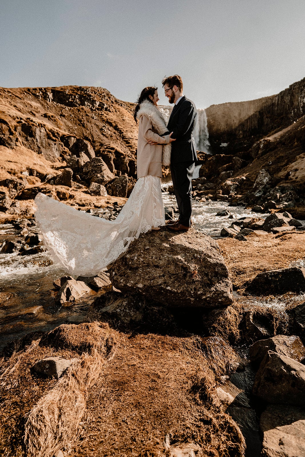 Western Iceland's Tranquility: Bride and Groom's Intimate Bond