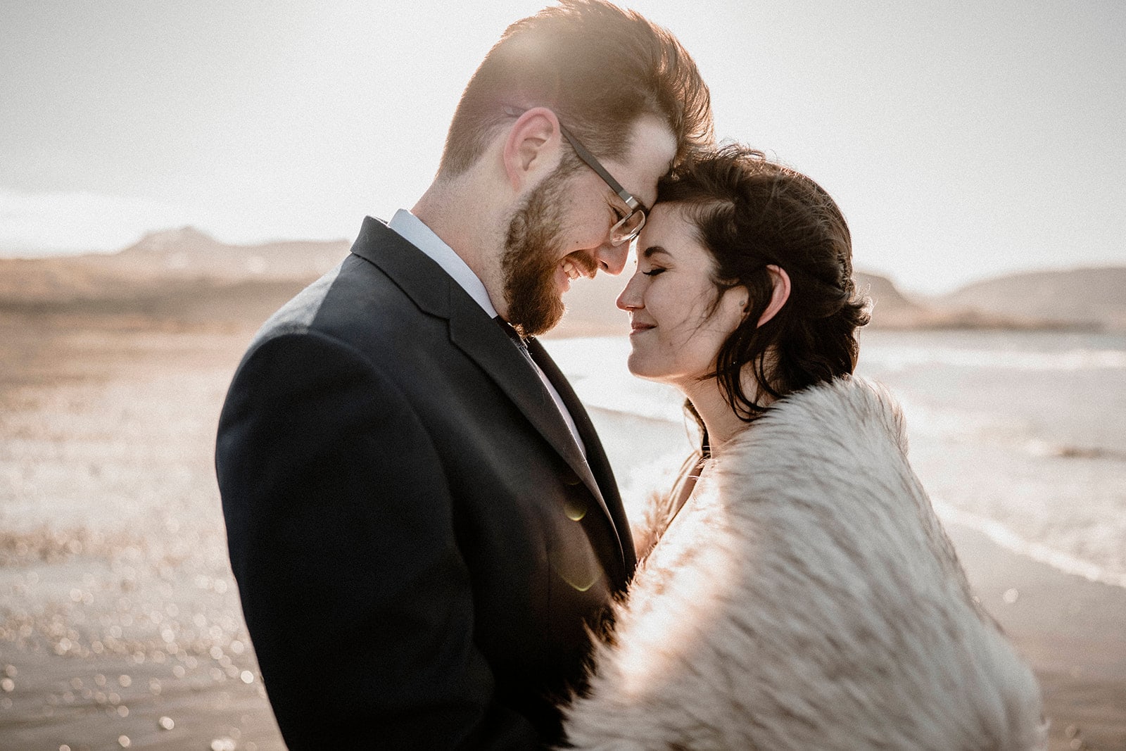 Windswept Elopement: Bride and Groom's Joyous Moment in Western Iceland