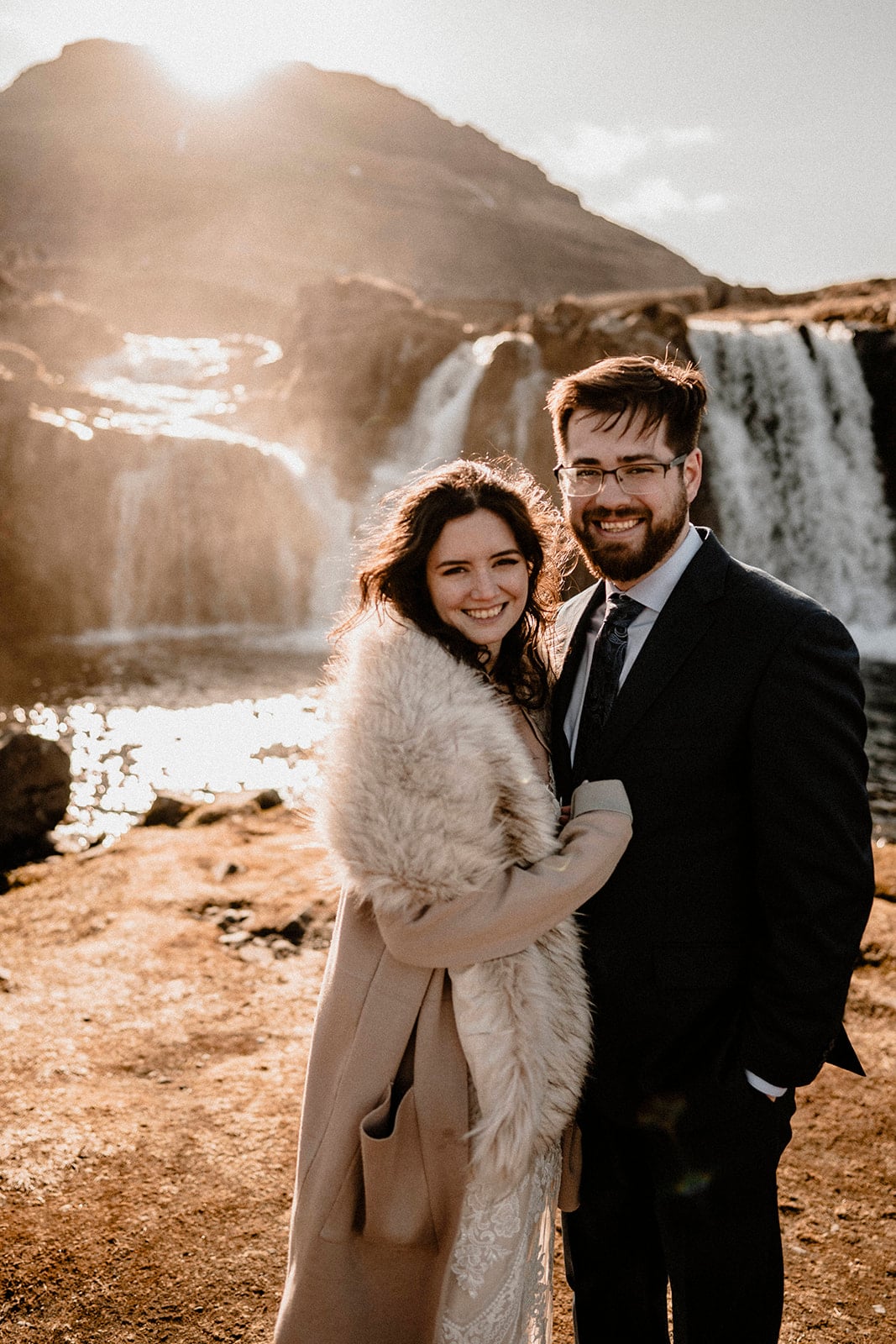 Windswept Happiness: Bride and Groom's Blissful Moment in Western Iceland