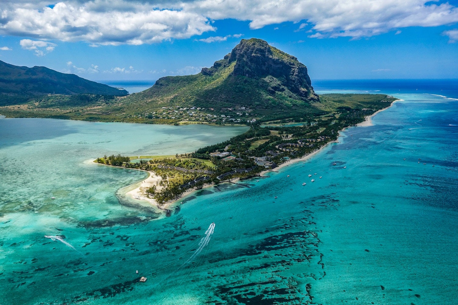Couple eloping on a Mauritius beach at golden hour