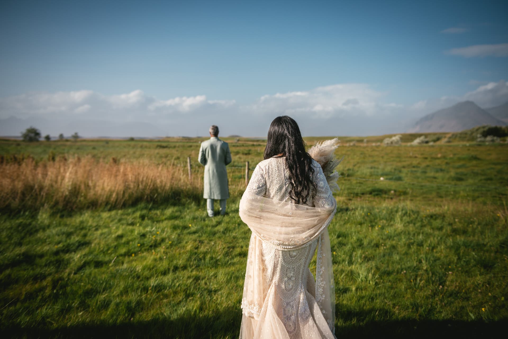 Bride's radiant walk on Icelandic shores