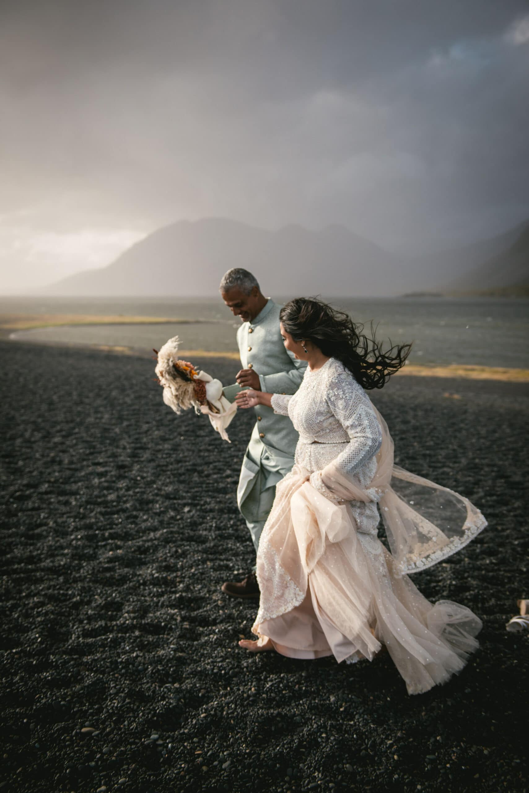 Bride's radiant walk on black sands