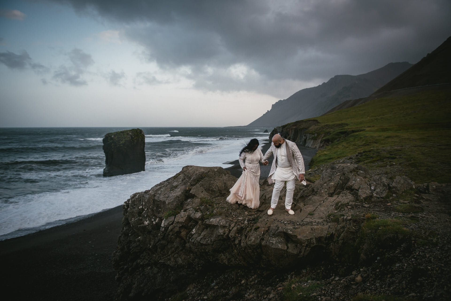Bride's enchanting walk on Icelandic shores