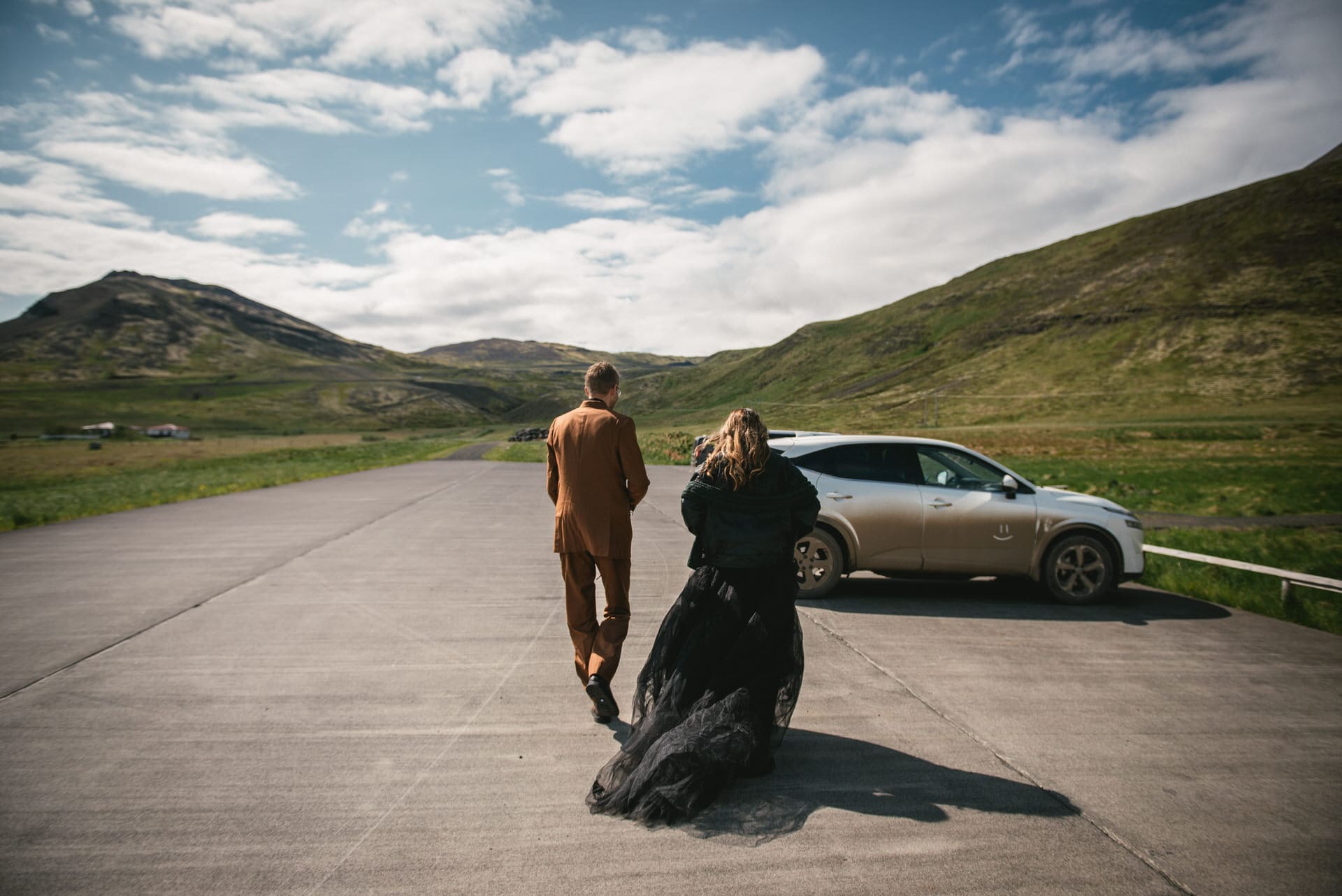 Adventurous couple hiking through the Icelandic wilderness during their Westfjords elopement.