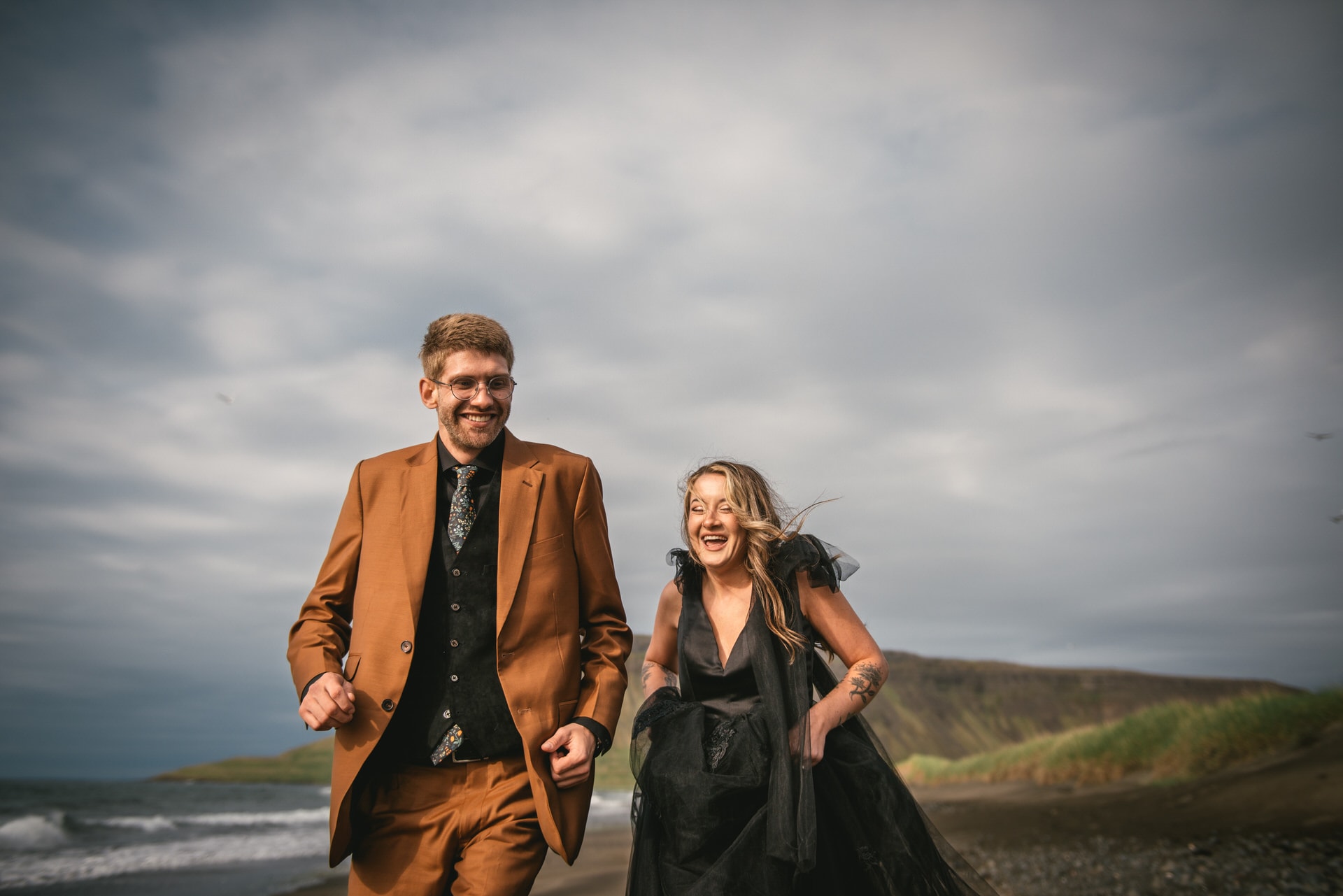 Warm embrace shared as the couple explores the untouched beauty of the Westfjords.