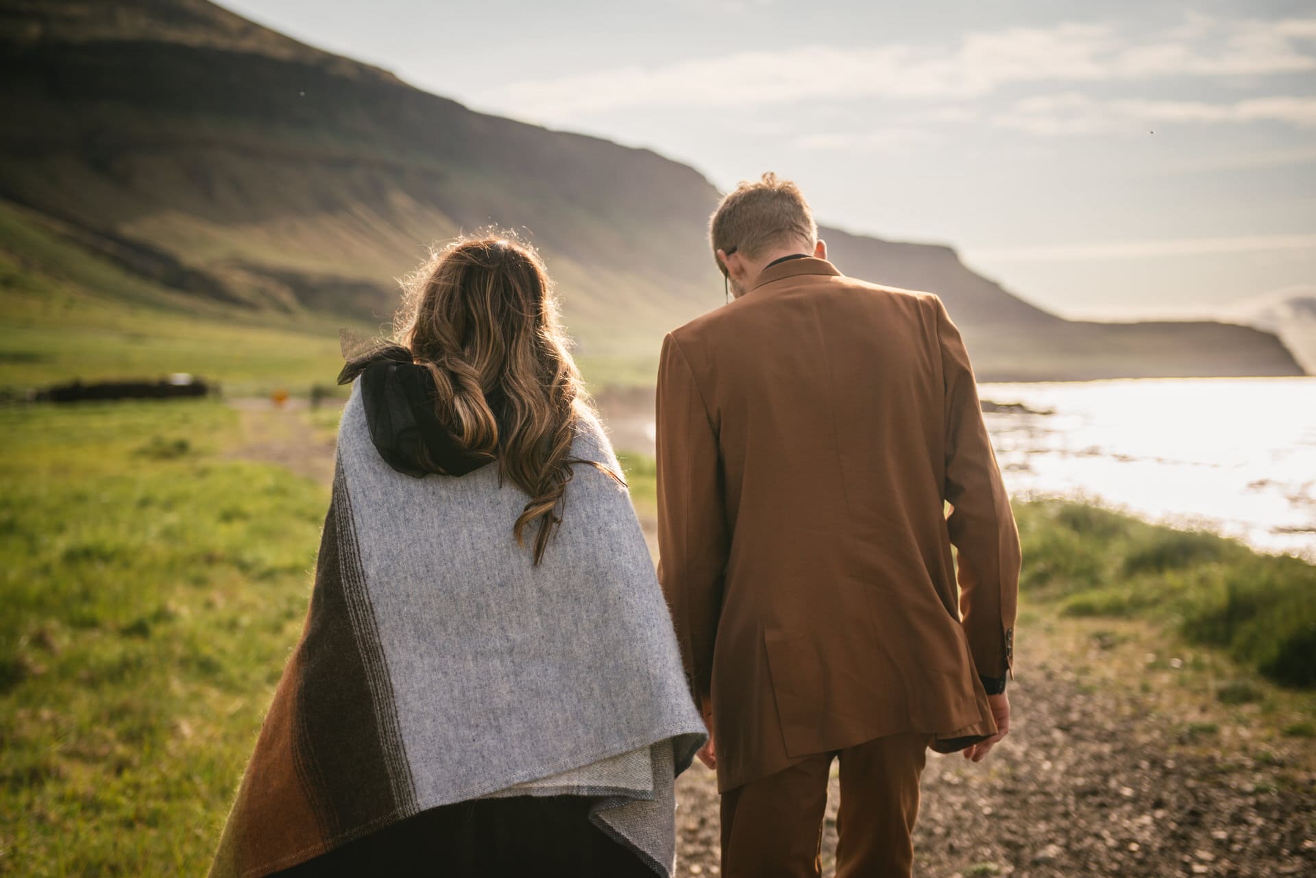 Adventurous couple explores the Westfjords' hidden gems, hand in hand.