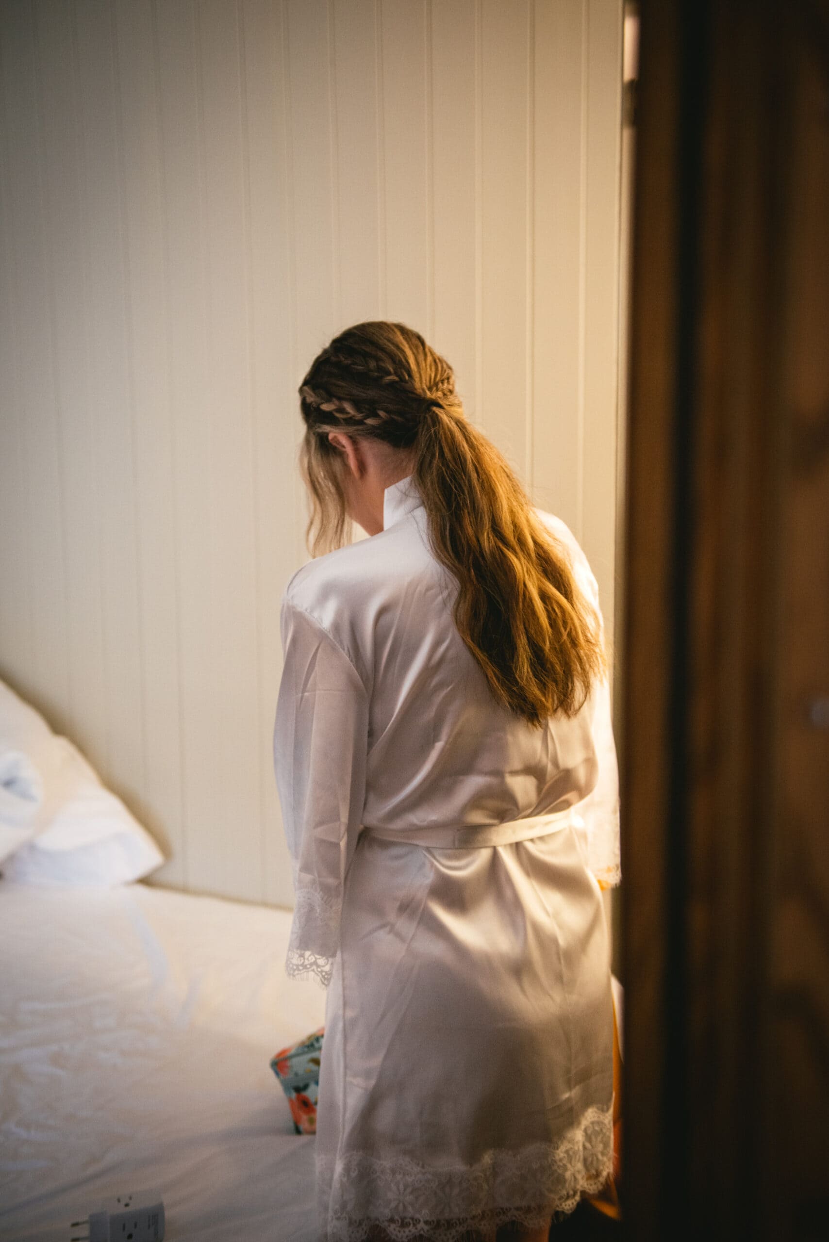 Captured in a moment of serenity, the bride readies herself for her Westfjords elopement amidst the breathtaking landscapes of Iceland.