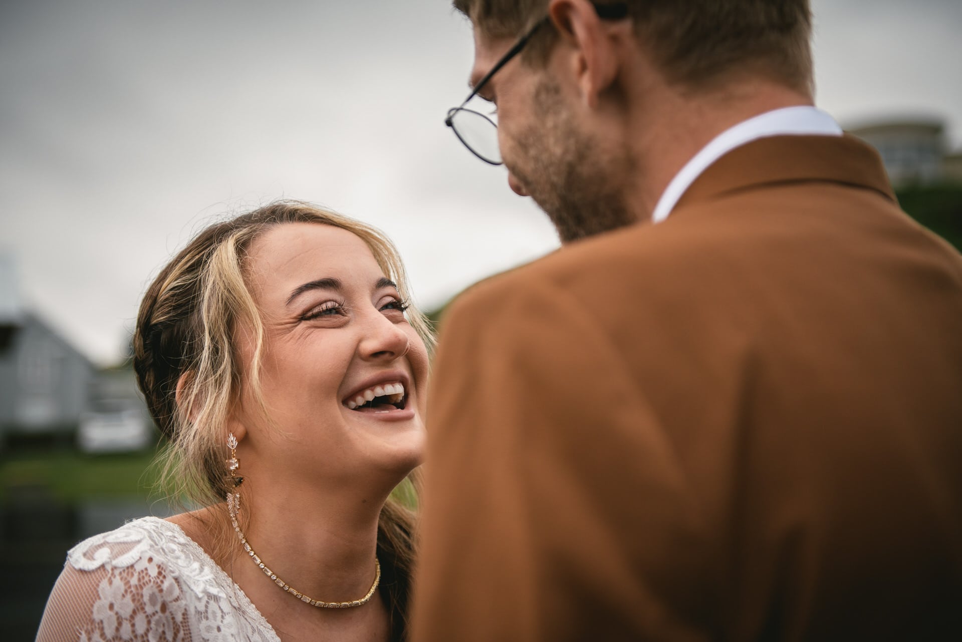 Candid laughter as the couple takes in the breathtaking views of their Westfjords elopement.