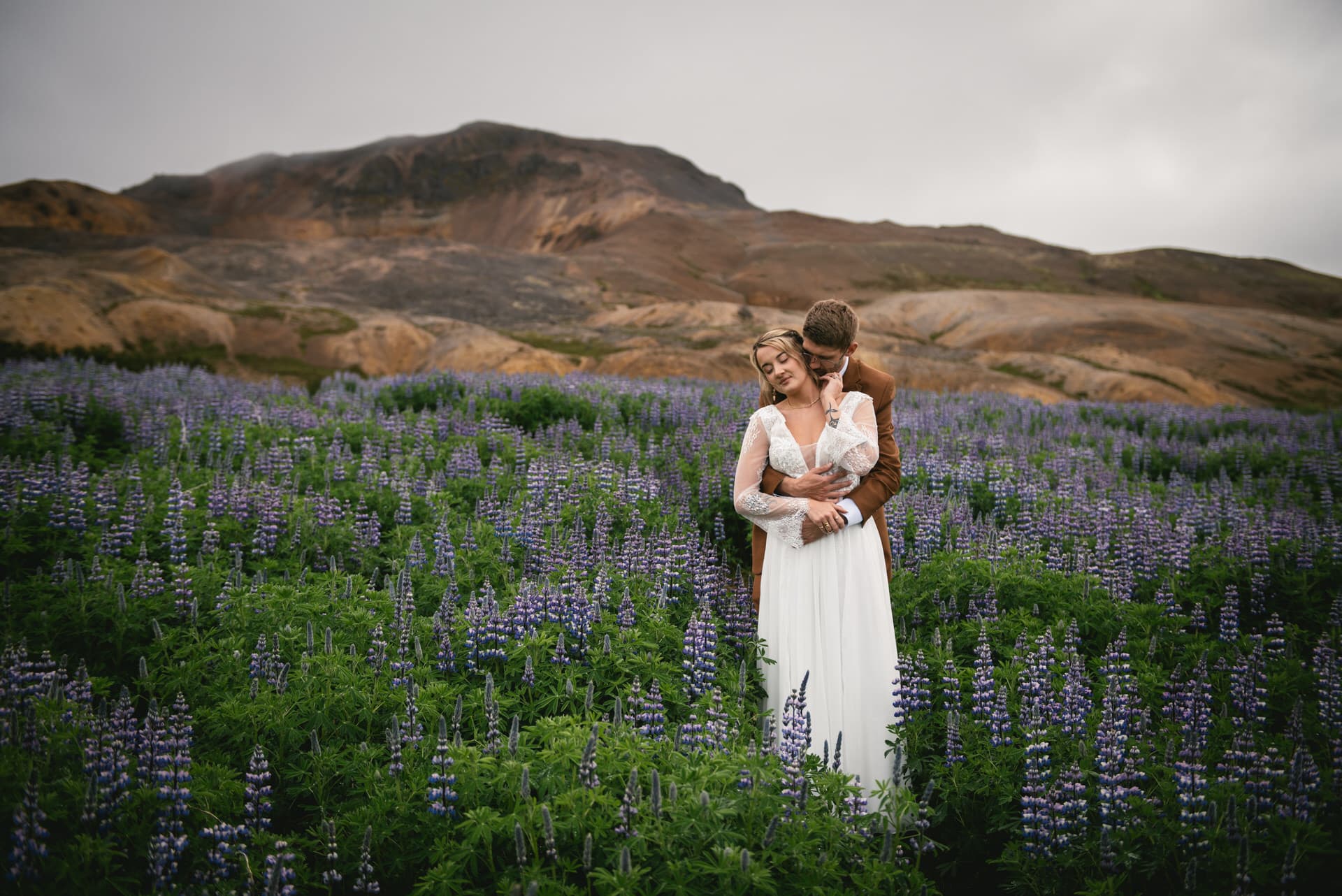 Windswept kisses shared amidst the stunning landscapes of an Iceland Westfjords elopement.
