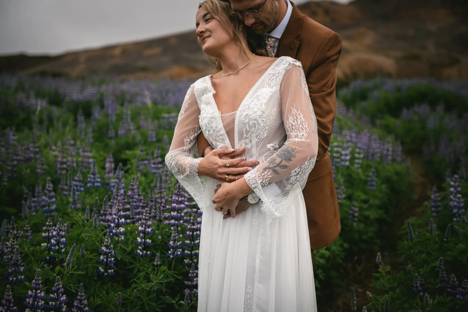 A heartfelt kiss shared against the backdrop of Iceland's rugged beauty.