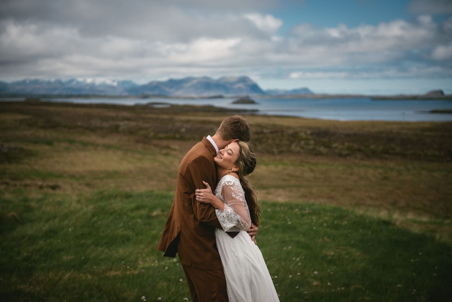 A kiss shared against the backdrop of Iceland's majestic Westfjords.