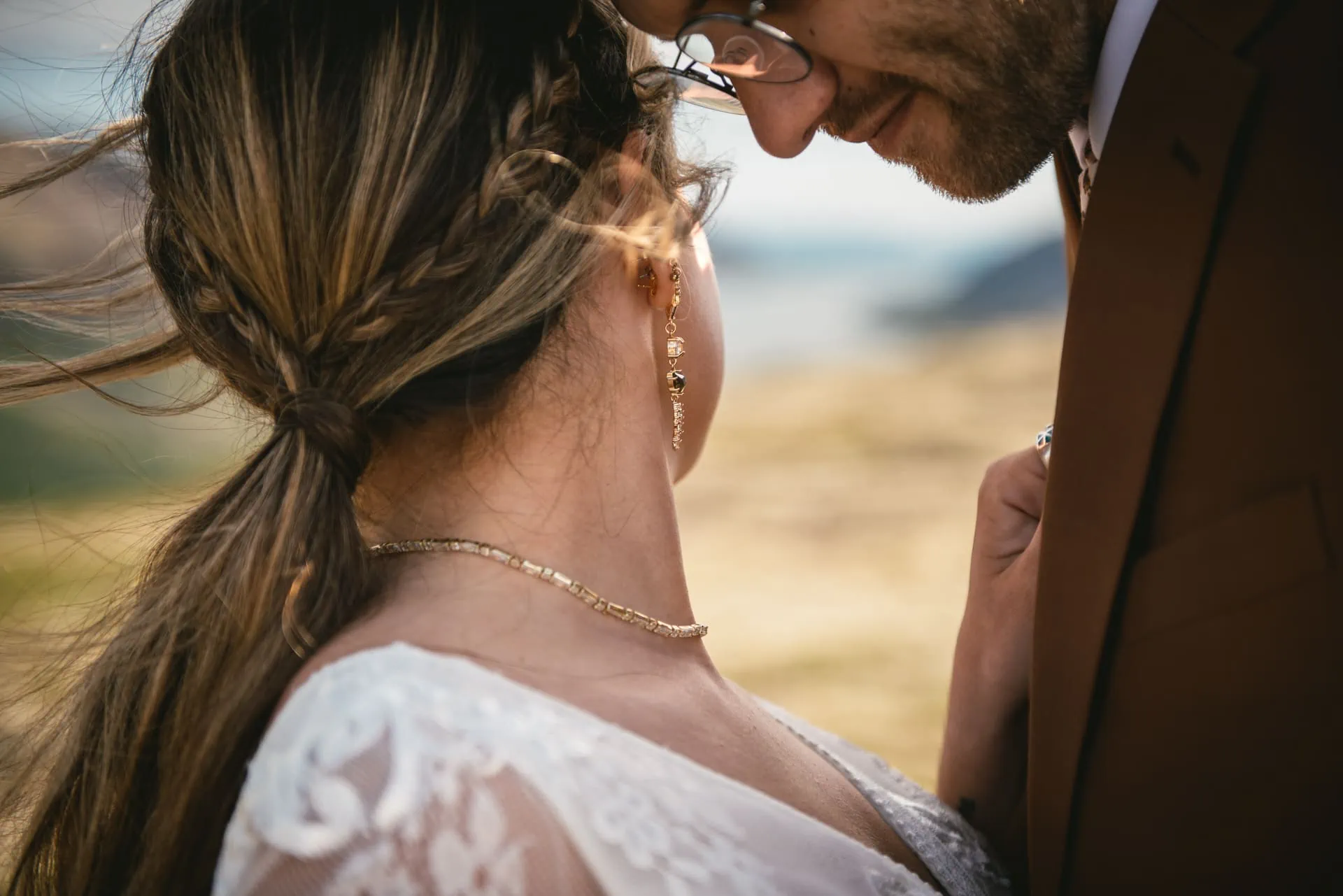 Bride and groom's silhouette framed by the vibrant colors of the Icelandic summer.