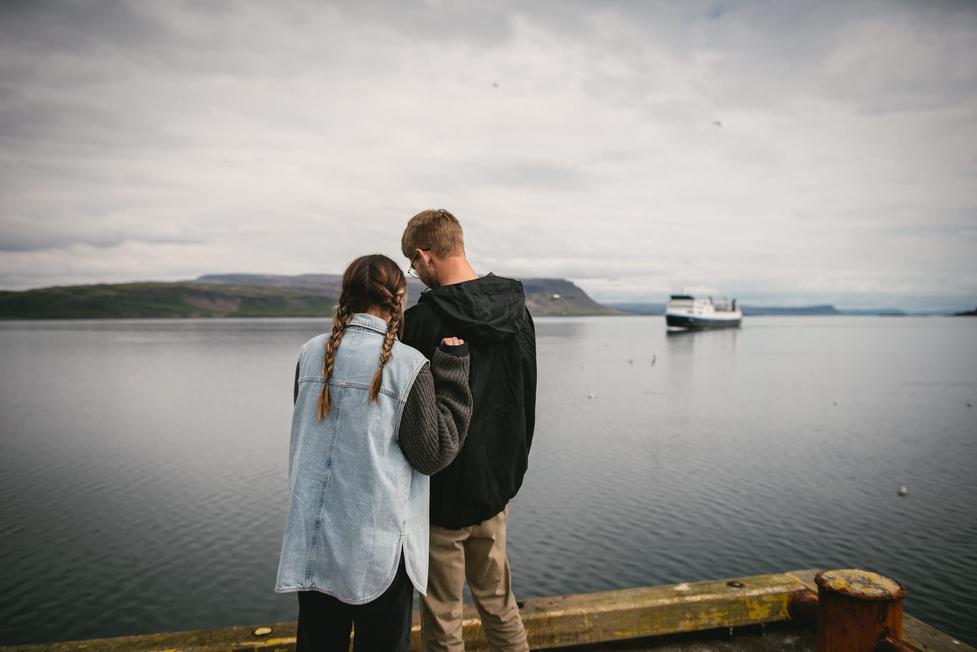 Embarking on a watery journey, their elopement tale is etched against the backdrop of the Iceland Westfjords, as they sail towards Snaefelseness.
