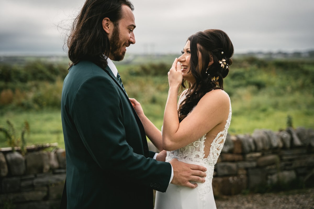 An Irish elopement moment: Capturing love on the rugged cliffs.