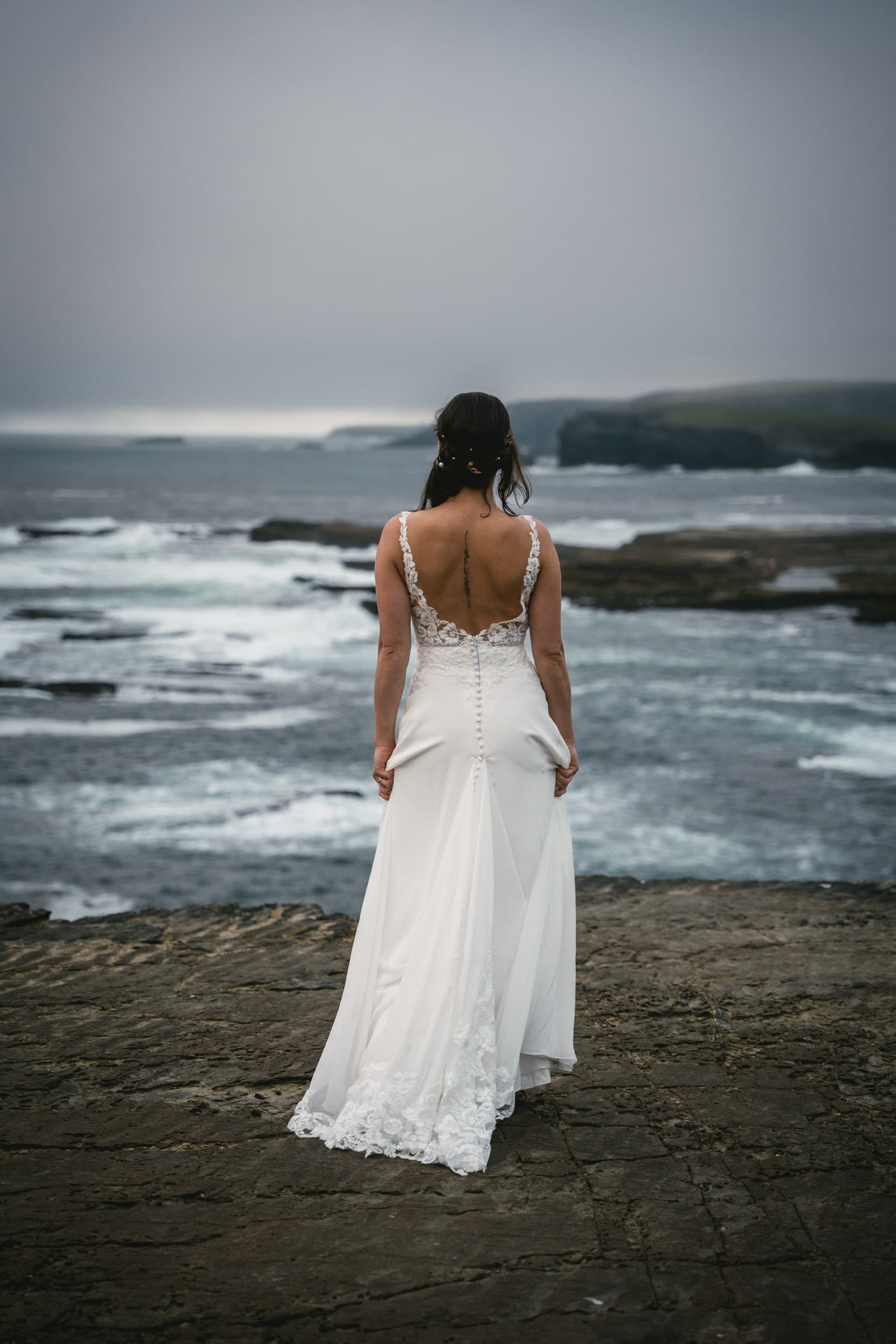 Irish elopement bliss: Capturing love against the misty cliffs.