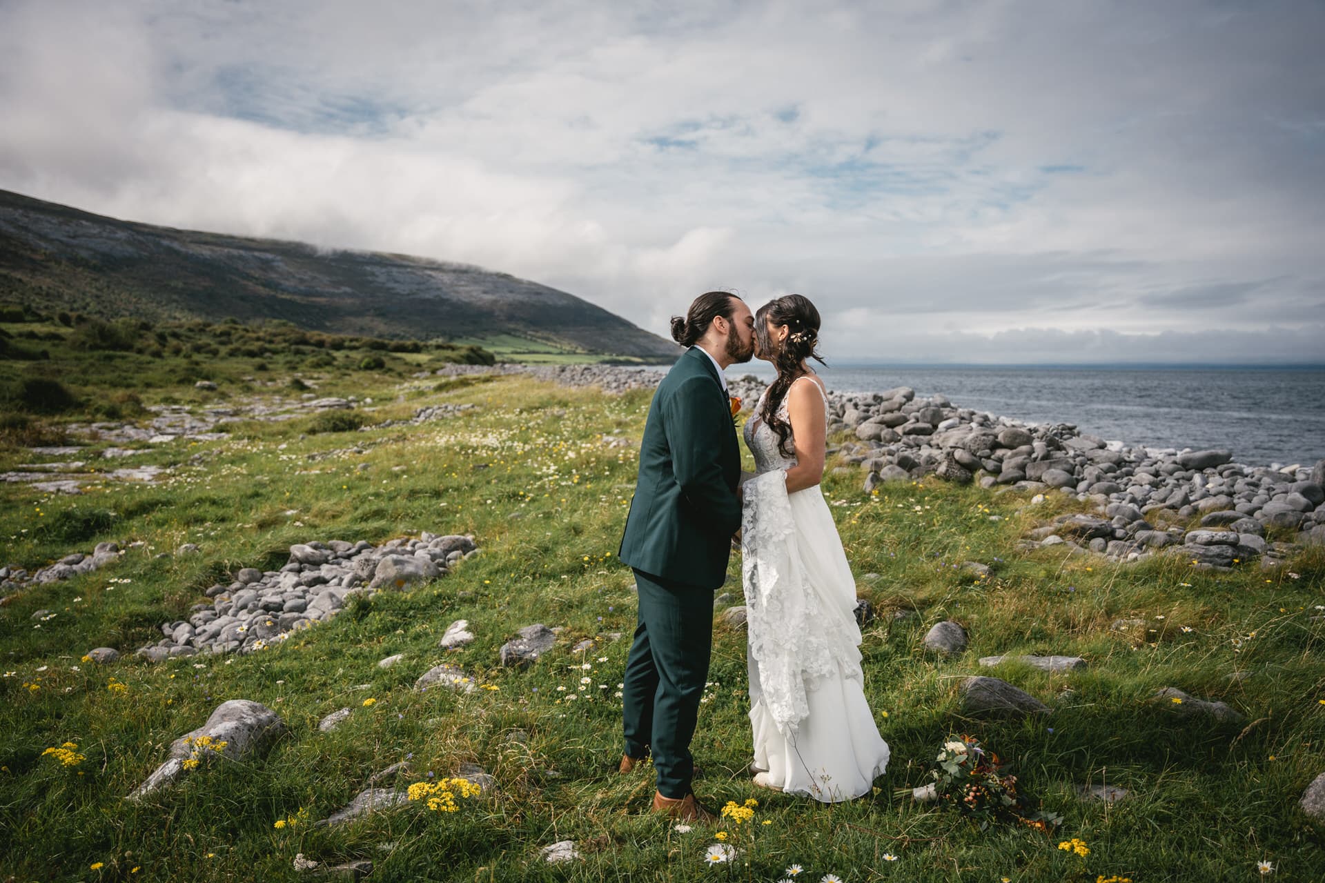A clifftop embrace during their Irish elopement.