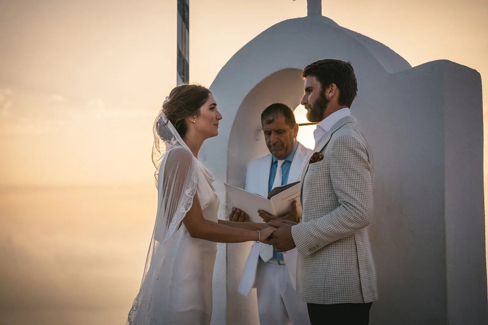 In the soft light of dusk, they hold each other, their ceremony a quiet declaration of love