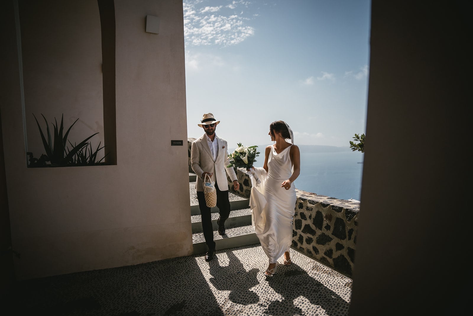 Hand in hand, exploring Fira’s charm, every step an elopement discovery