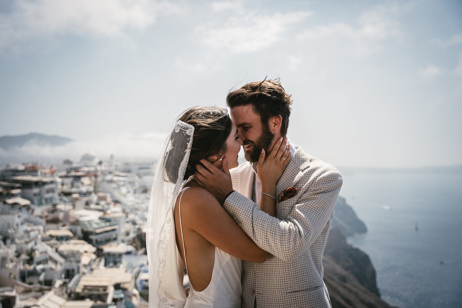 Stolen kisses in secluded corners of Fira, where every alley whispers tales of romance