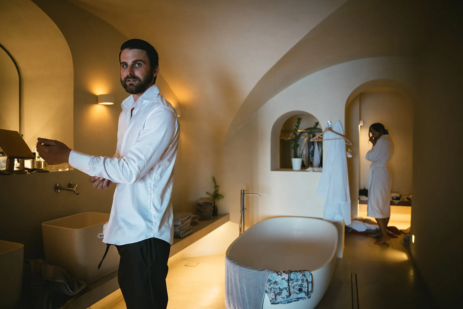 Another glimpse of the groom in the bathroom, a quiet pause before the vows