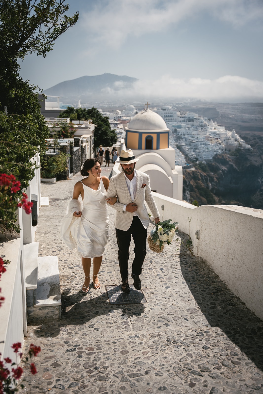 A laughter-filled chase through Fira’s maze, their spirits as free as the Aegean breeze