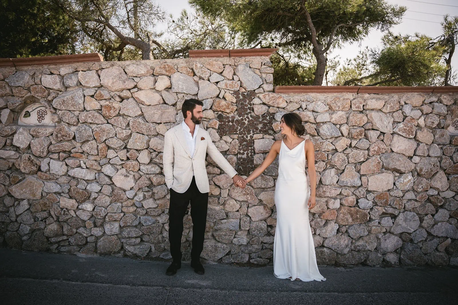 Hand in hand, their love echoes against the ancient stones of the old church
