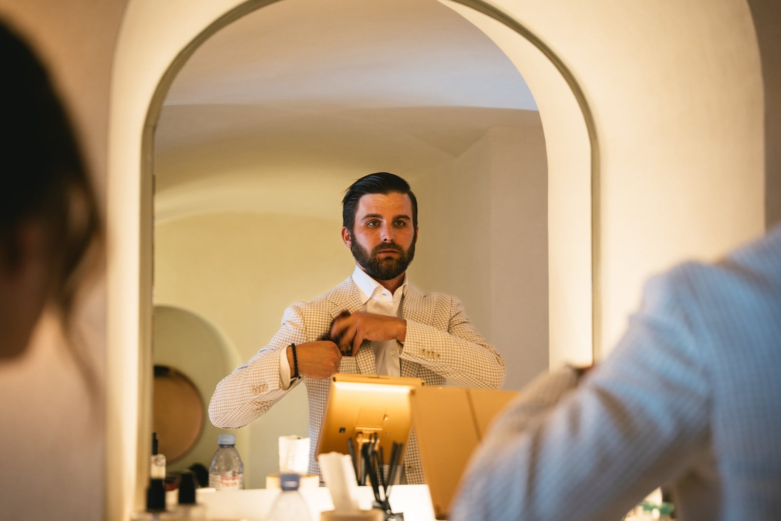 Groom’s reflective moment in the bathroom, preparing heart and soul for the elopement