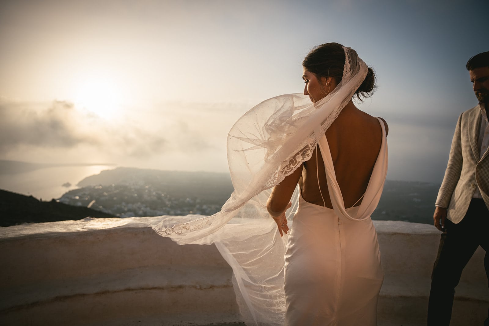 Their walk to the ceremony, a symbolic passage through Santorini’s beauty, into union