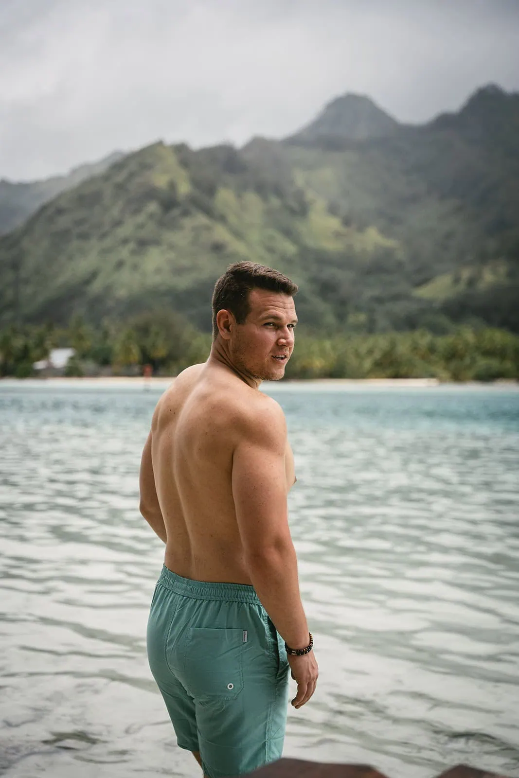 Groom in a quiet corner of their beachside resort in French Polynesia.