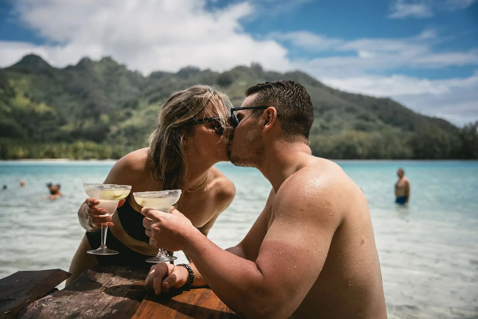 Bride and groom embracing near the beach, celebrating their love in French Polynesia