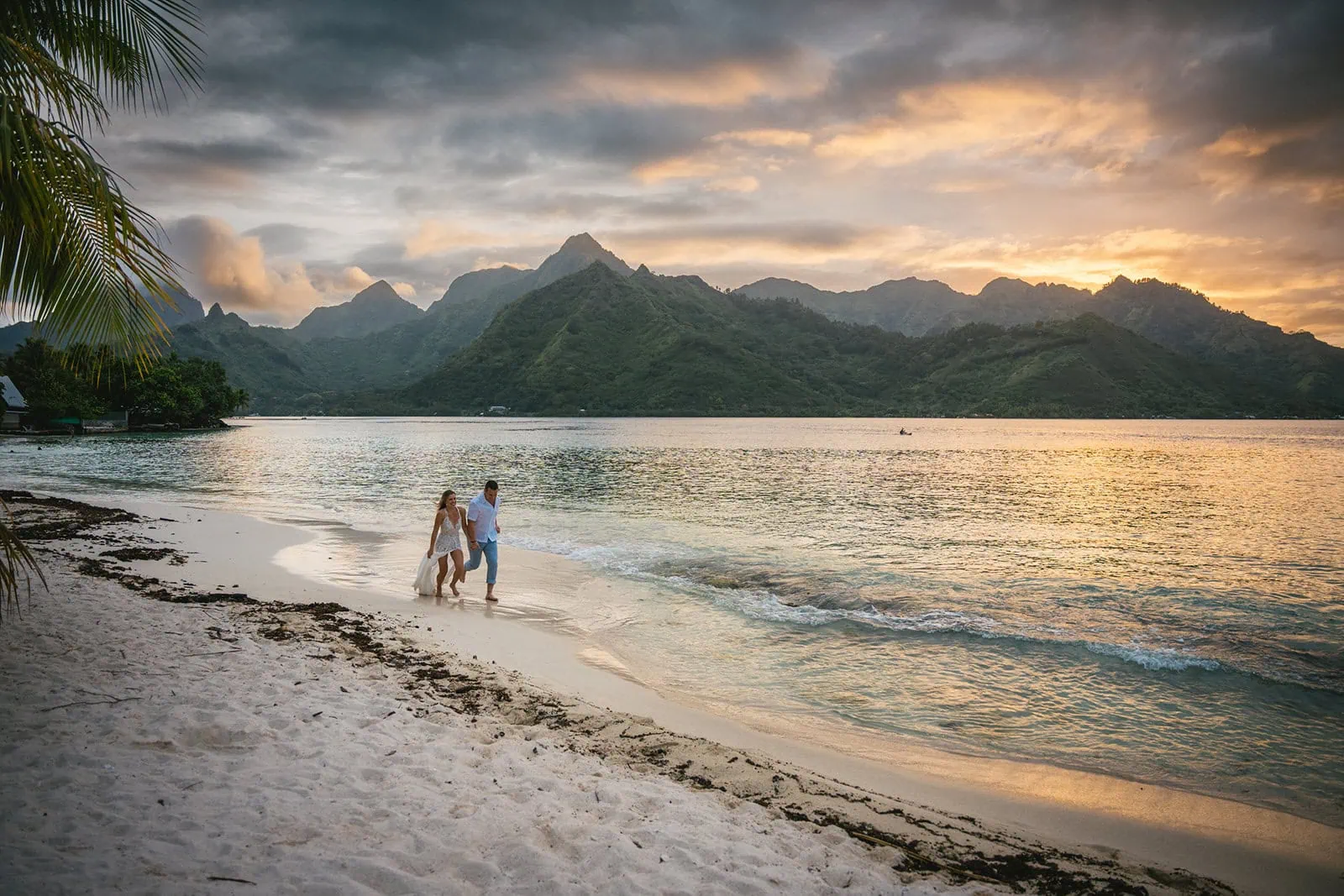 Couple enjoying a sunset in their French Polynesia elopement