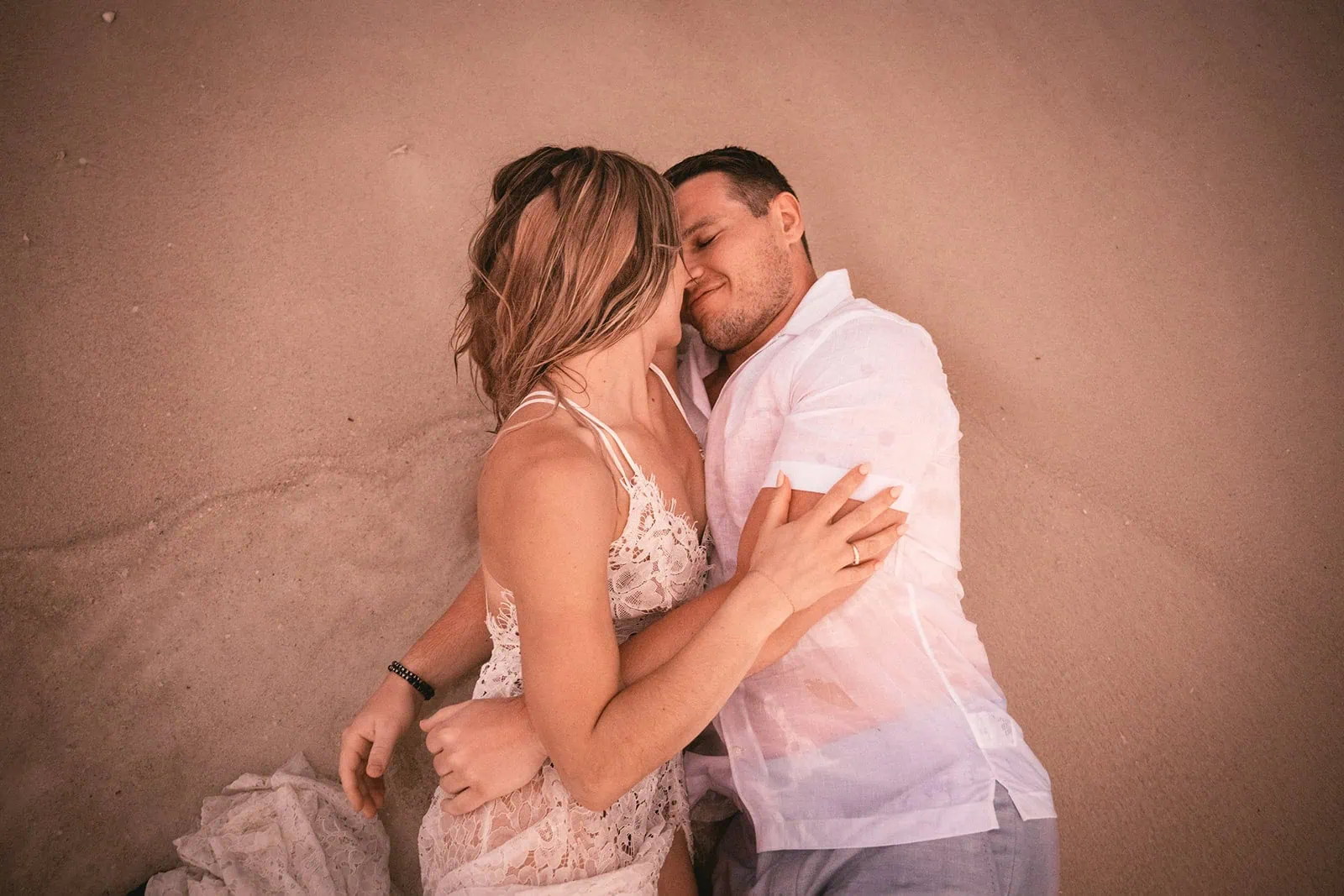 Close-up of the bride and he groom in the ocean in French Polynesia