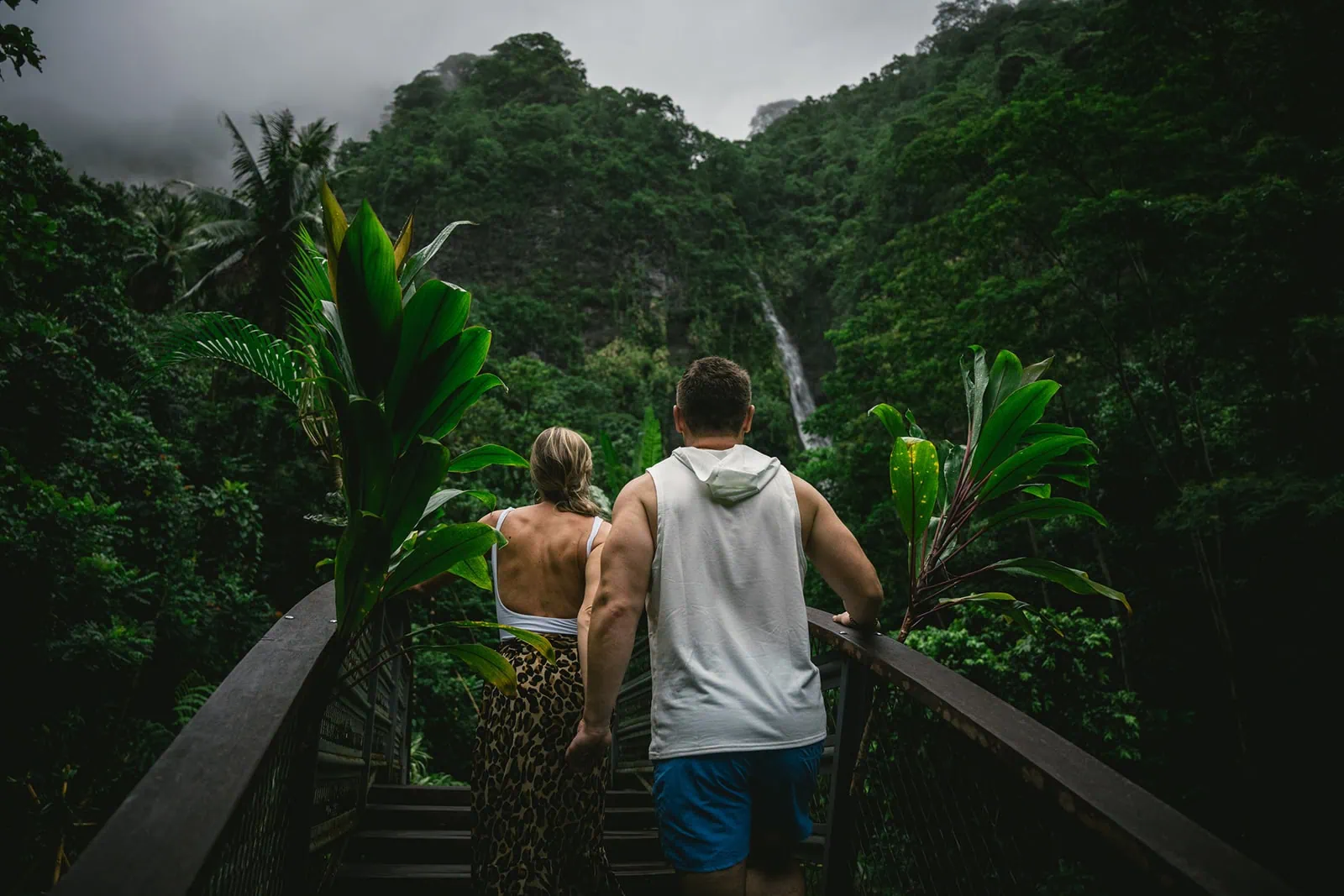 Couple walking hand by hand in French Polynesia