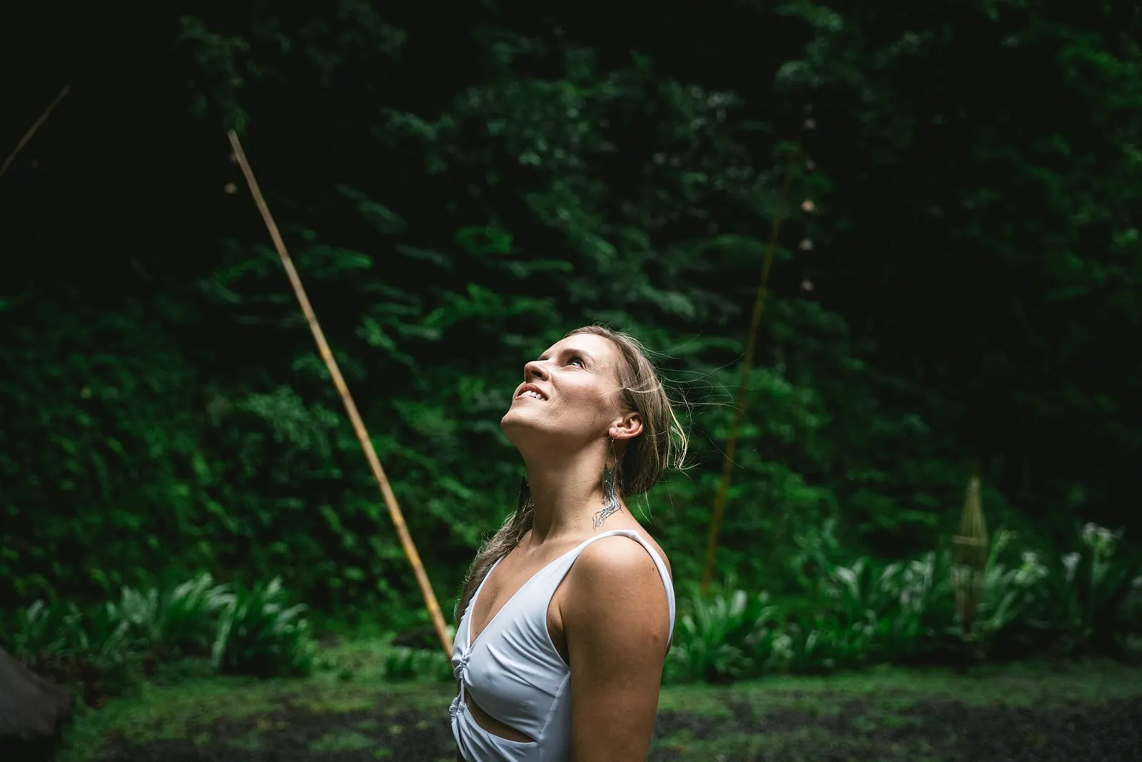 Bride gazing at the lush forest in French Polynesia