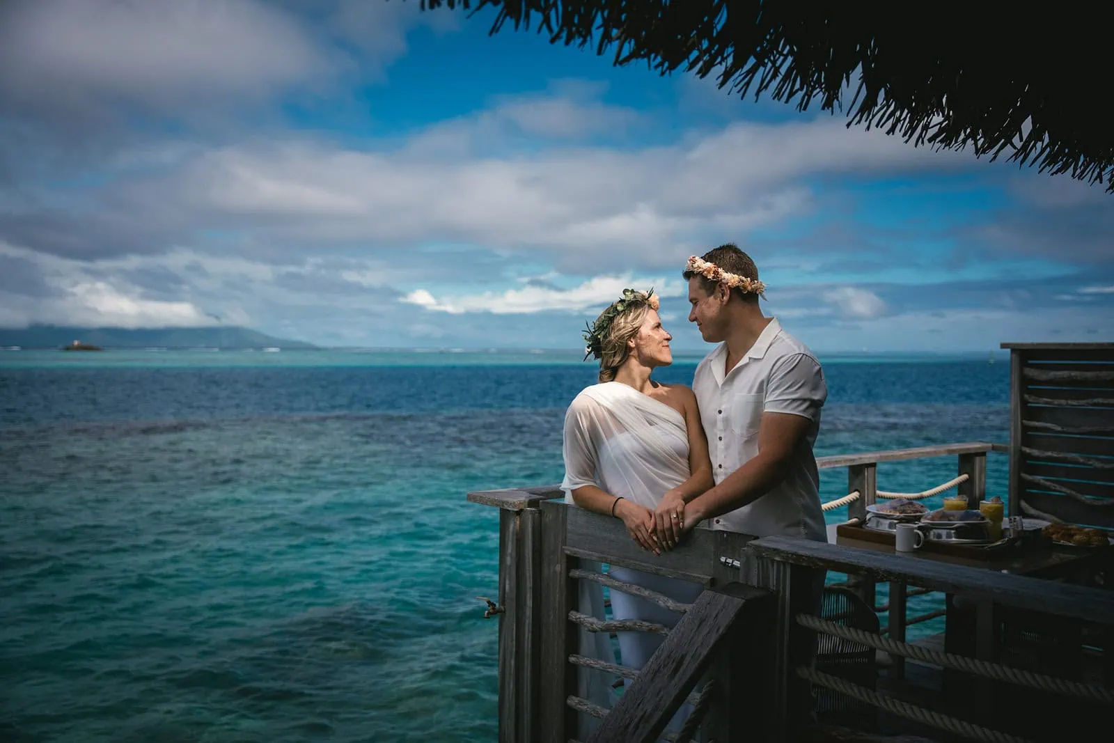 Couple embrace near the Polynesian ocean