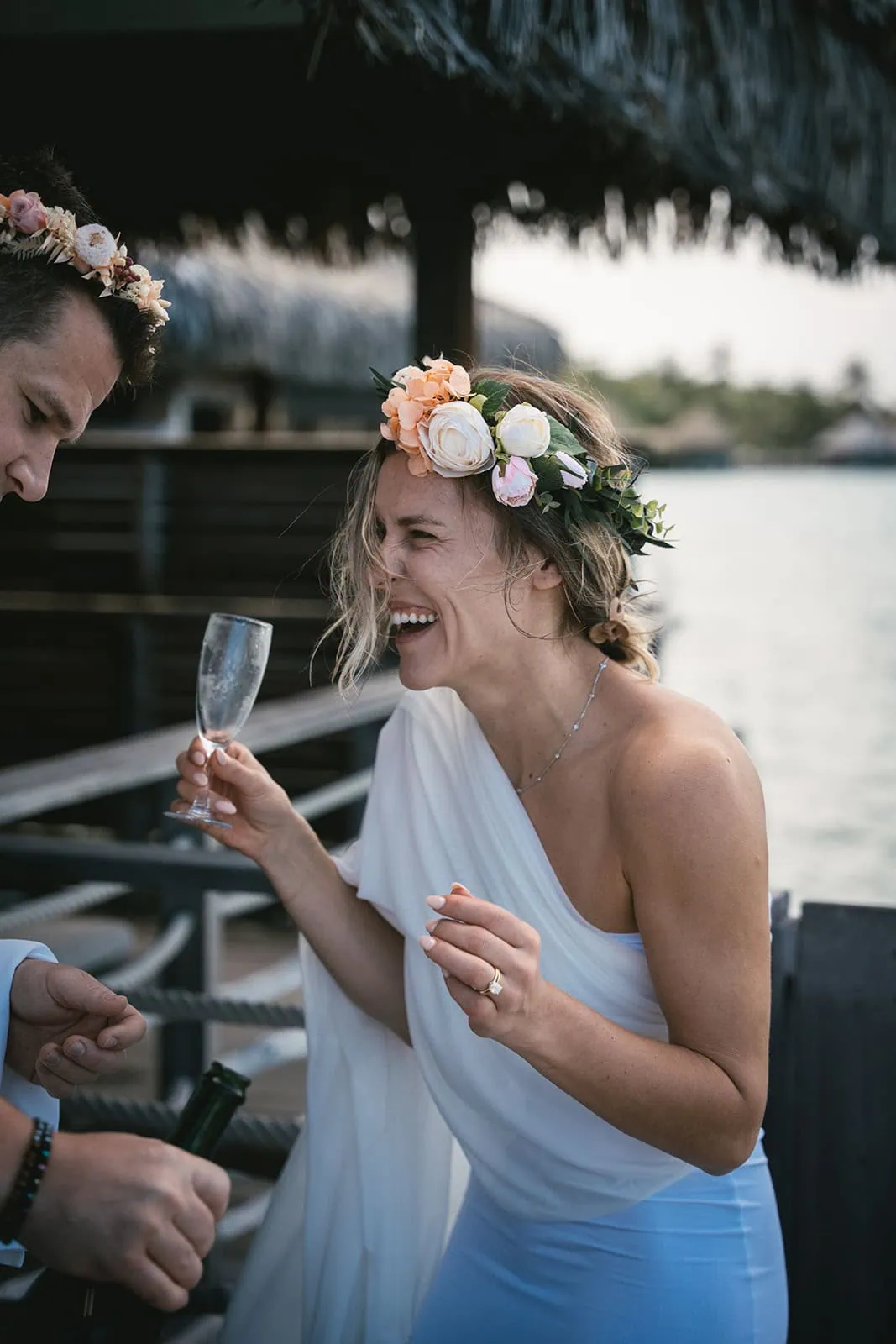 Couple toasting with champagne during their elopement in French Polynesia