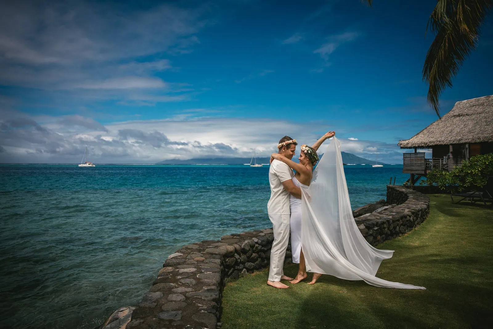 Couple taking a moment to enjoy the peaceful ocean view in French Polynesia