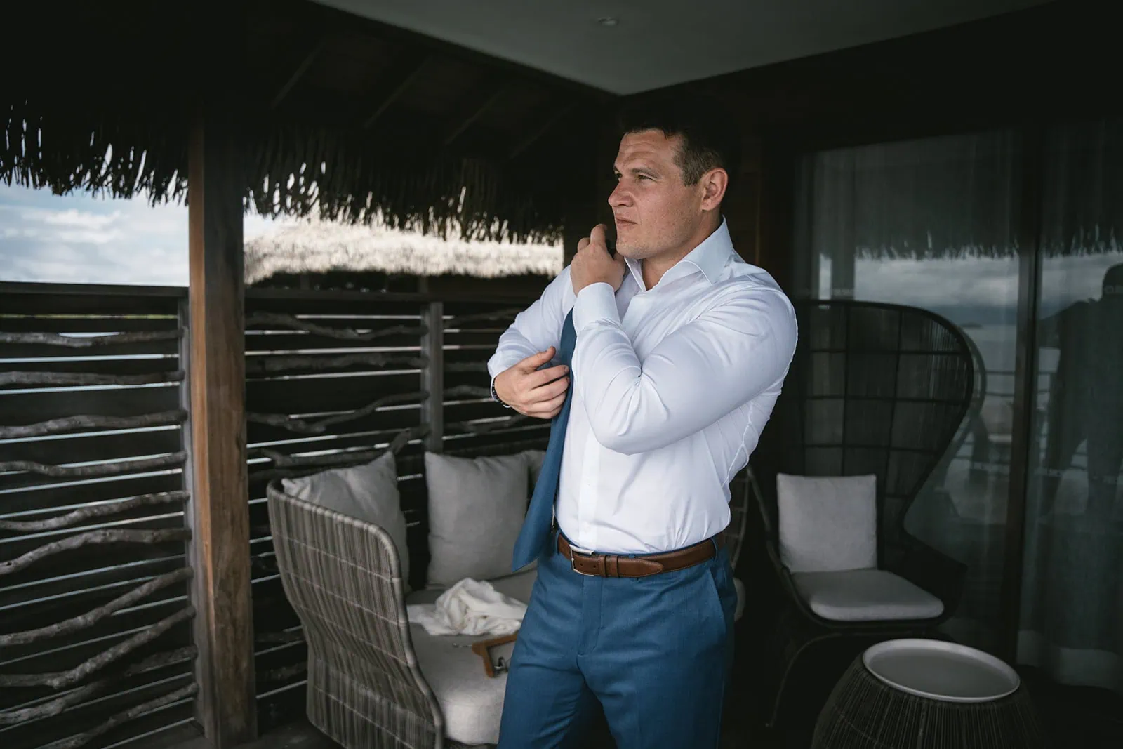 Groom as he prepares for his elopement day in French Polynesia