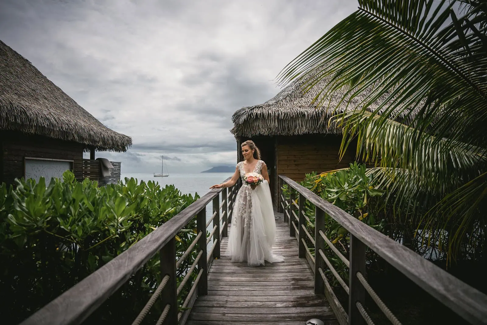 Bride's joyful expression as she walks to meet her groom in French Polynesia