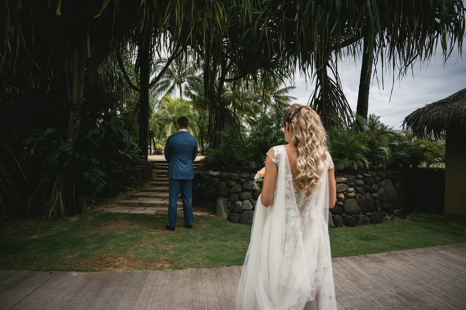 Bride smiling brightly as she sees her groom for the first time in French Polynesia