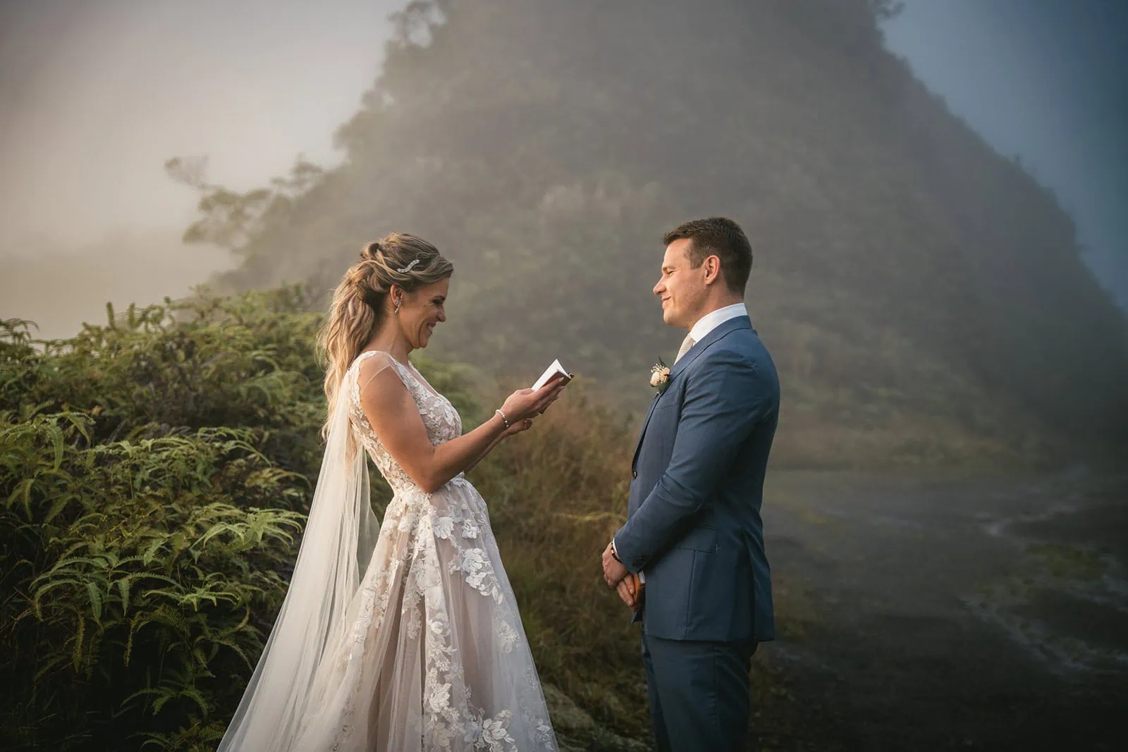Groom looking lovingly at his bride during their beachside elopement in French Polynesia