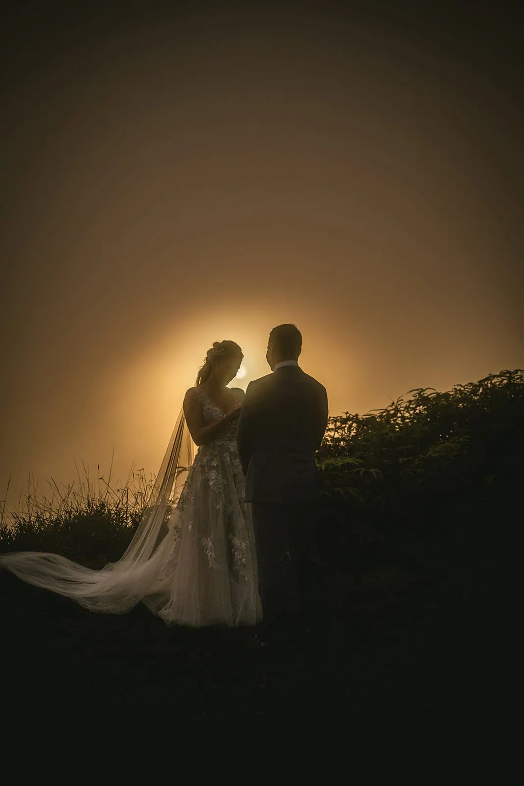 Intimate moment captured between the couple as they exchange leis in French Polynesia