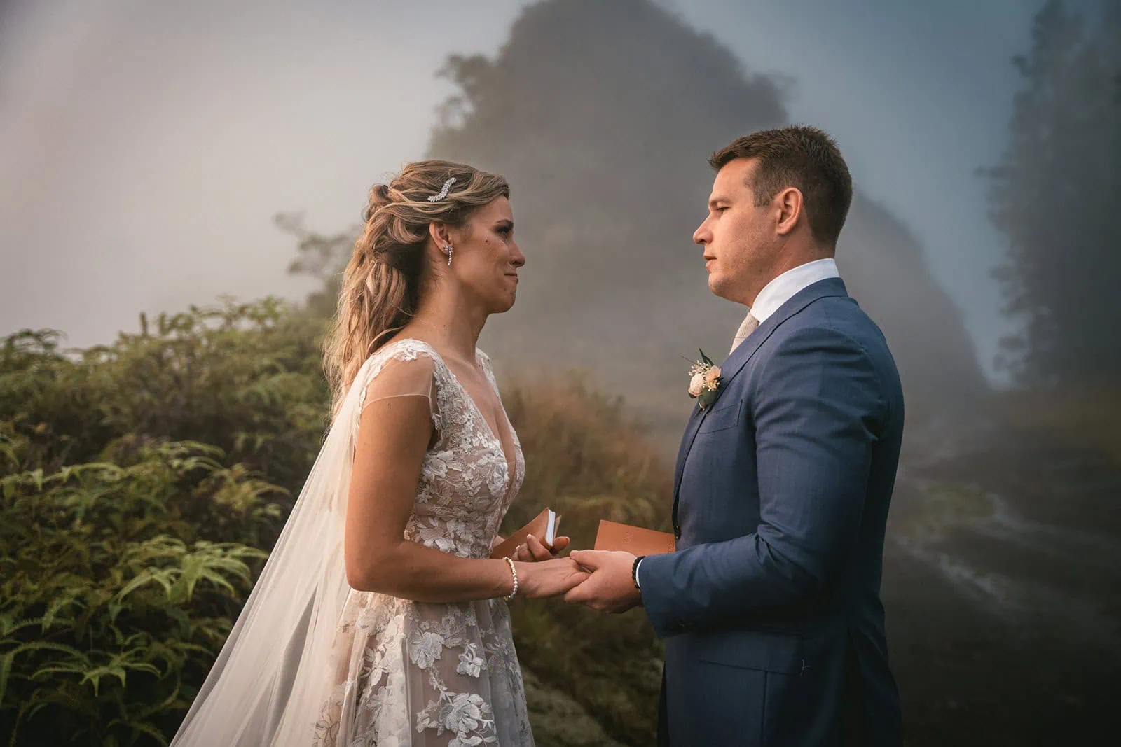 Couple exchanging vows under the sunset in French Polynesia