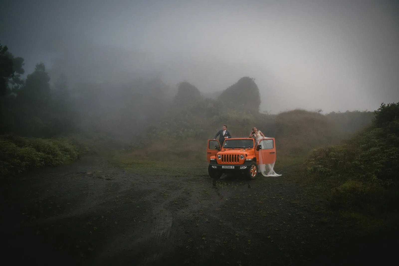 Newlyweds in a jeep during their French Polynesia elopement