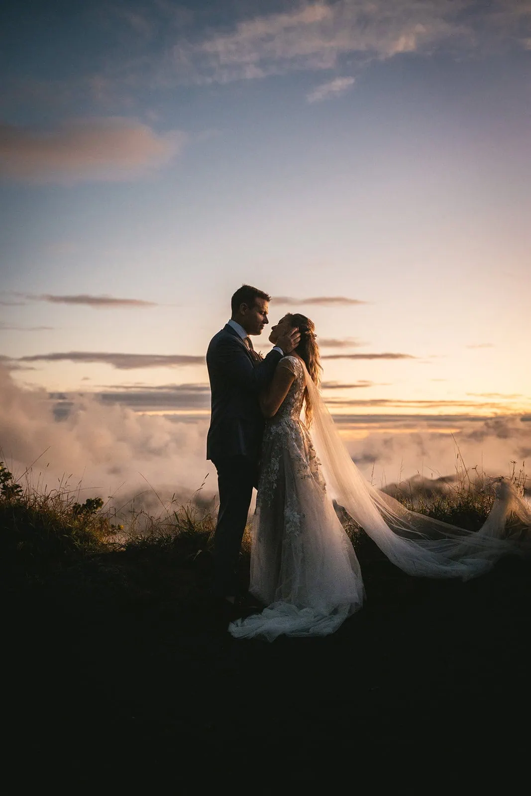 Newlyweds' silhouettes dancing in the sunset of French Polynesia